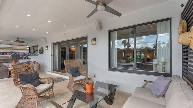 view of patio with french doors, ceiling fan, and an outdoor living space