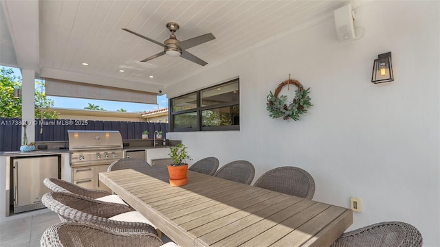 view of patio featuring ceiling fan, area for grilling, grilling area, and sink