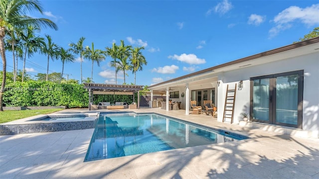 view of pool featuring a patio, an in ground hot tub, a pergola, an outdoor living space, and french doors