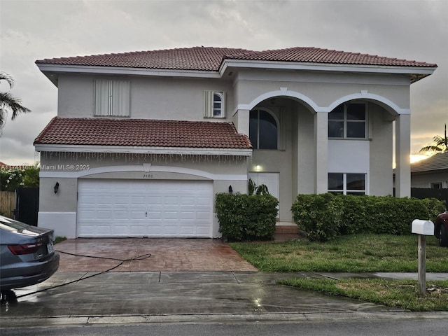 mediterranean / spanish-style house featuring a garage