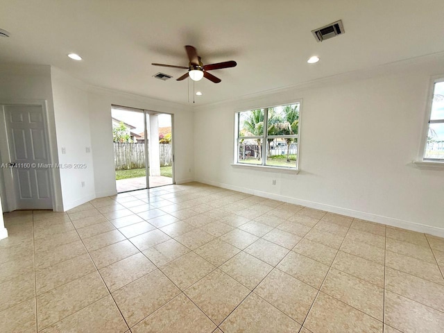 spare room featuring baseboards, visible vents, ornamental molding, and recessed lighting