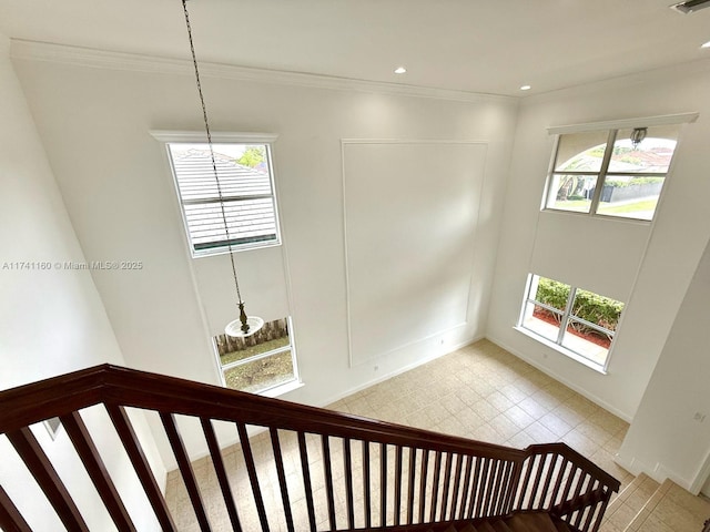 stairway with recessed lighting, visible vents, and crown molding