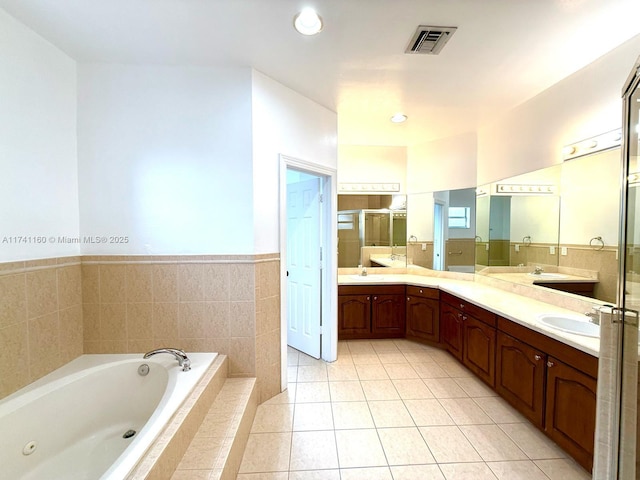 full bath featuring a shower stall, visible vents, a sink, and tile patterned floors