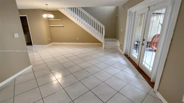 interior space with light tile patterned flooring and a notable chandelier