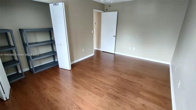 unfurnished bedroom with hardwood / wood-style floors