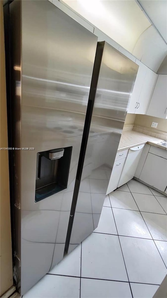 details with stainless steel fridge and white cabinets