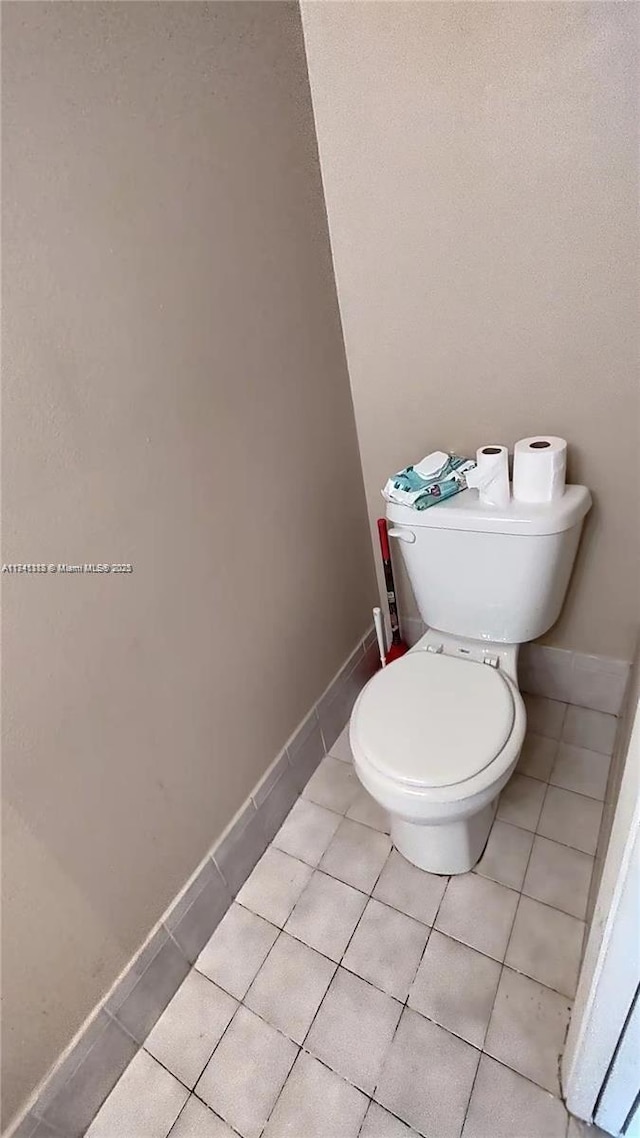 bathroom featuring tile patterned flooring and toilet