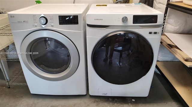 clothes washing area featuring independent washer and dryer