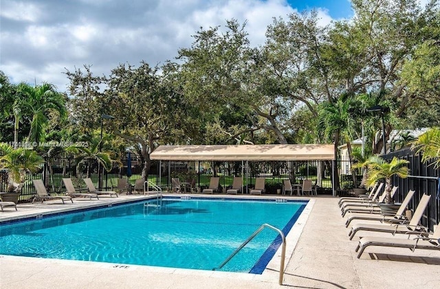 view of swimming pool with a patio area