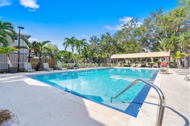 view of swimming pool with a patio