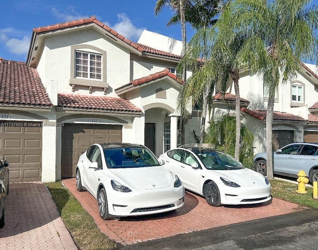 mediterranean / spanish house with a garage