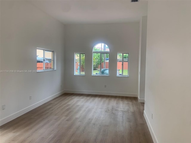 spare room featuring light wood-type flooring