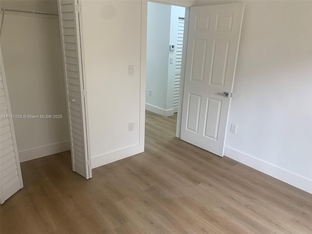 2511 NE 41st Ter, Homestead, FL 33033 - unfurnished bedroom with light wood-type flooring and a closet