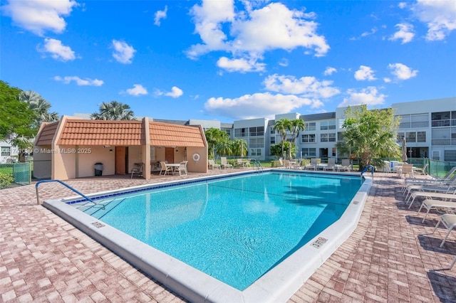 view of swimming pool featuring a patio area