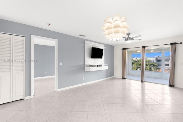 unfurnished living room with light tile patterned floors and ceiling fan