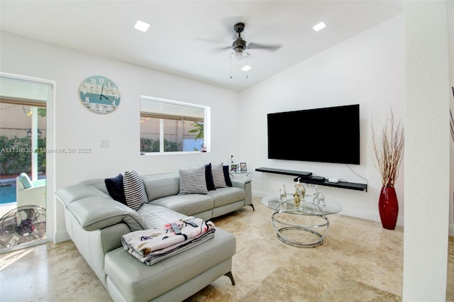 living room with lofted ceiling and ceiling fan