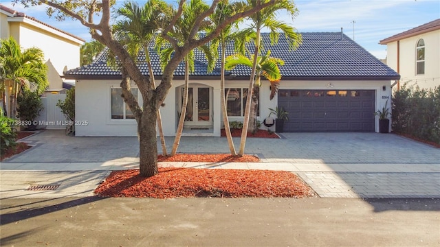 mediterranean / spanish house with a garage