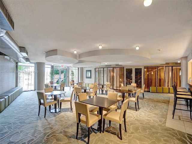 2681 N Flamingo Rd Unit 605S, Sunrise, FL 33323 - dining room featuring light colored carpet and a wall of windows