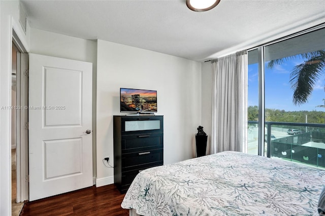 2681 N Flamingo Rd Unit 605S, Sunrise, FL 33323 - bedroom featuring dark wood-style flooring, floor to ceiling windows, and baseboards