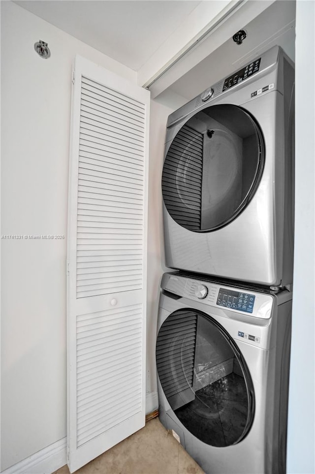 2681 N Flamingo Rd Unit 605S, Sunrise, FL 33323 - laundry area featuring stacked washer / drying machine and baseboards