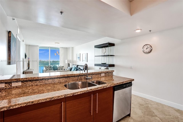 2681 N Flamingo Rd Unit 605S, Sunrise, FL 33323 - kitchen with dishwasher, a sink, brown cabinets, baseboards, and open floor plan