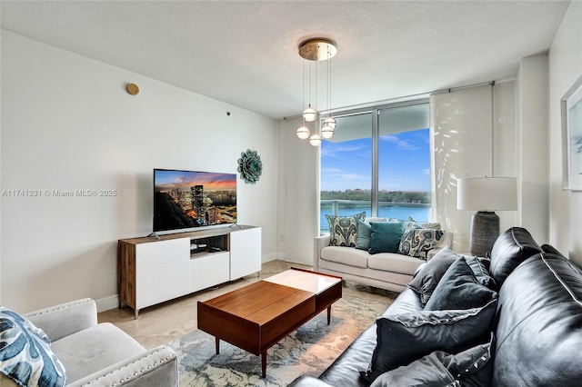 2681 N Flamingo Rd Unit 605S, Sunrise, FL 33323 - living area featuring expansive windows and baseboards