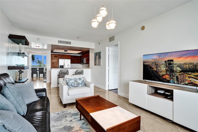 2681 N Flamingo Rd Unit 605S, Sunrise, FL 33323 - living area featuring a chandelier and baseboards