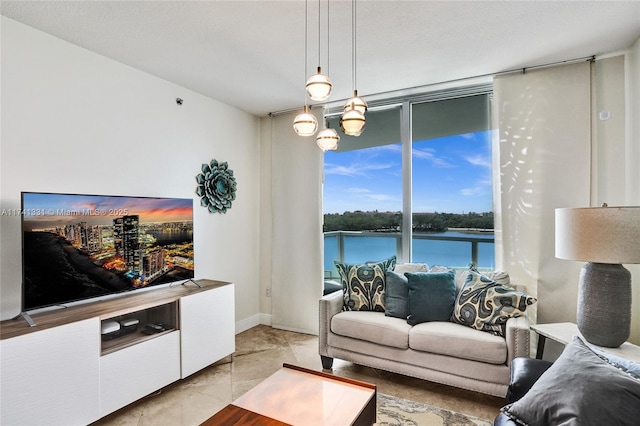 2681 N Flamingo Rd Unit 605S, Sunrise, FL 33323 - living room featuring a wall of windows and a water view