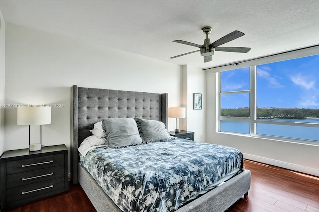 2681 N Flamingo Rd Unit 605S, Sunrise, FL 33323 - bedroom featuring dark wood finished floors, a ceiling fan, and baseboards