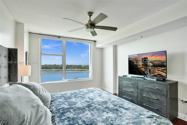 2681 N Flamingo Rd Unit 605S, Sunrise, FL 33323 - bedroom with baseboards, a ceiling fan, and dark wood-style floors