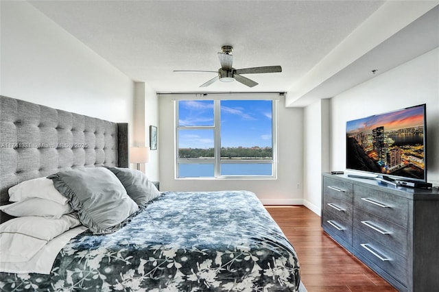 2681 N Flamingo Rd Unit 605S, Sunrise, FL 33323 - bedroom featuring dark wood-style floors, ceiling fan, and baseboards