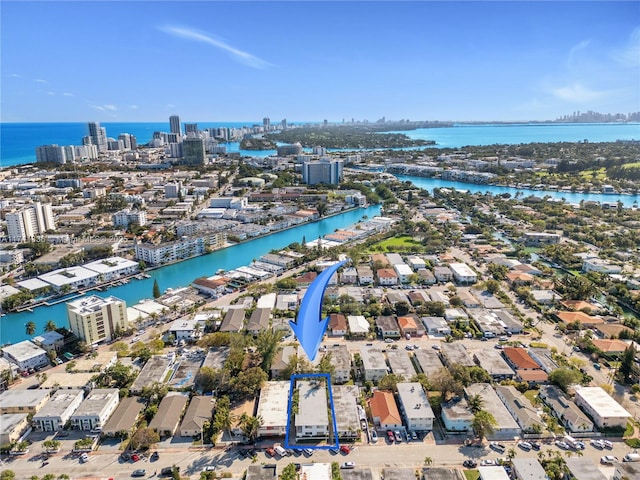 birds eye view of property featuring a water view