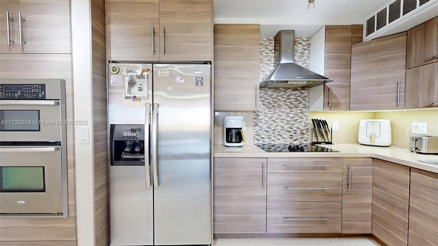 600 N Three Islands Blvd Unit 803, Hallandale Beach, FL 33009 - kitchen featuring wall chimney range hood, stainless steel appliances, modern cabinets, and light countertops