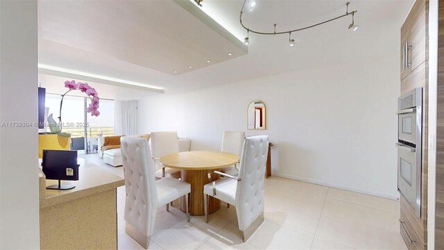 600 N Three Islands Blvd Unit 803, Hallandale Beach, FL 33009 - dining space with light tile patterned flooring and baseboards