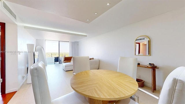 600 N Three Islands Blvd Unit 803, Hallandale Beach, FL 33009 - dining area with visible vents, floor to ceiling windows, and baseboards