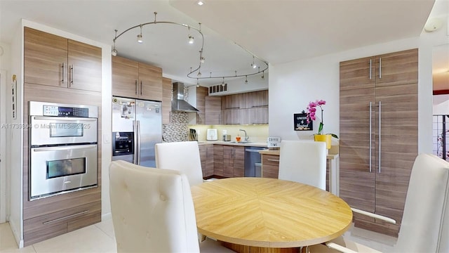 600 N Three Islands Blvd Unit 803, Hallandale Beach, FL 33009 - kitchen with visible vents, appliances with stainless steel finishes, modern cabinets, a sink, and wall chimney exhaust hood