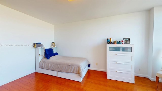600 N Three Islands Blvd Unit 803, Hallandale Beach, FL 33009 - bedroom with light wood-style floors and baseboards