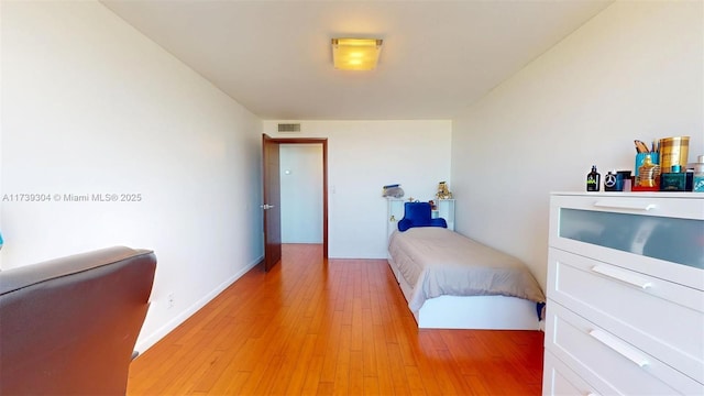 600 N Three Islands Blvd Unit 803, Hallandale Beach, FL 33009 - bedroom with visible vents and light wood-style flooring