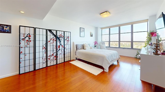 600 N Three Islands Blvd Unit 803, Hallandale Beach, FL 33009 - bedroom featuring baseboards, recessed lighting, and wood finished floors