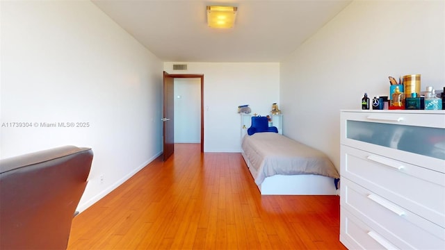 600 N Three Islands Blvd Unit 803, Hallandale Beach, FL 33009 - bedroom with visible vents, light wood finished floors, and baseboards