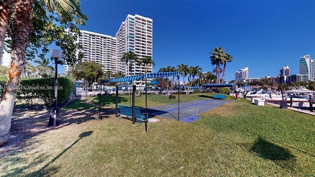 600 N Three Islands Blvd Unit 803, Hallandale Beach, FL 33009 - view of property's community with a city view and a yard