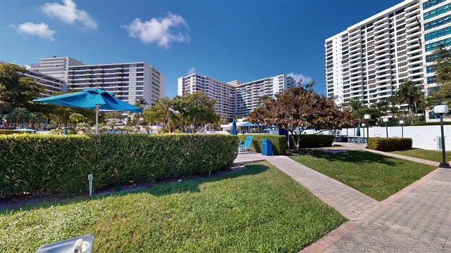 600 N Three Islands Blvd Unit 803, Hallandale Beach, FL 33009 - surrounding community with a yard