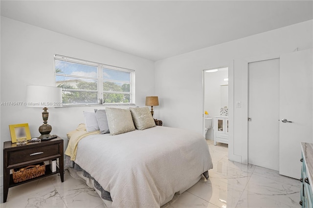 bedroom featuring ensuite bath