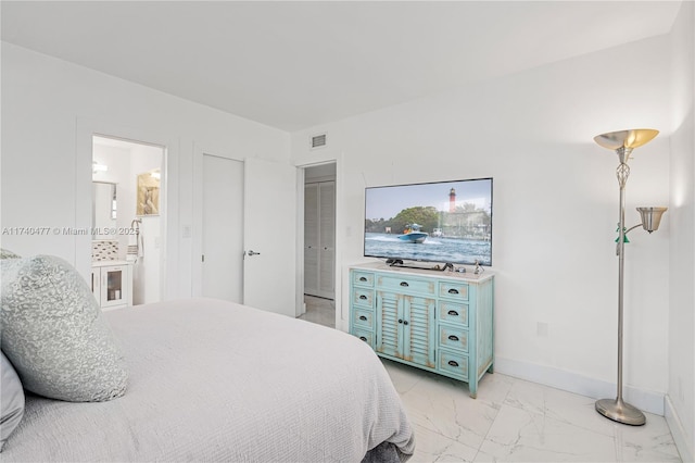 bedroom featuring connected bathroom