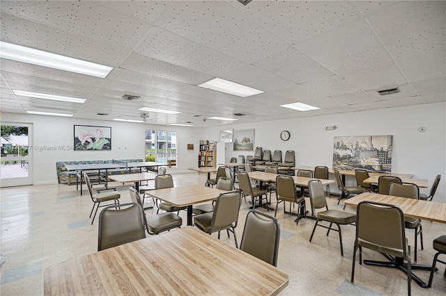 dining room with a paneled ceiling