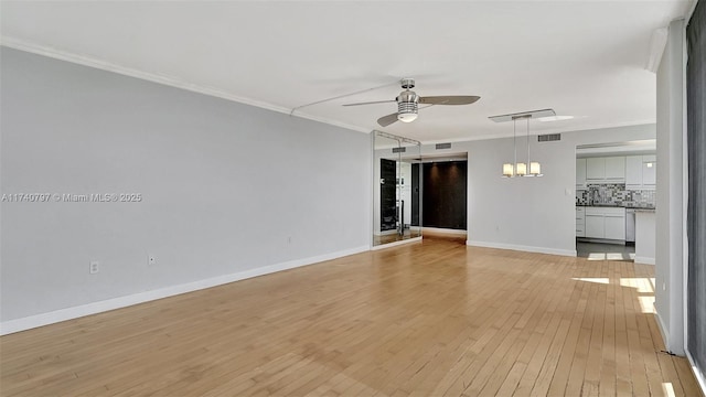 2801 NE 183rd St Unit 517W, Aventura, FL 33160 - spare room with ceiling fan, light wood-style floors, ornamental molding, baseboards, and a chandelier