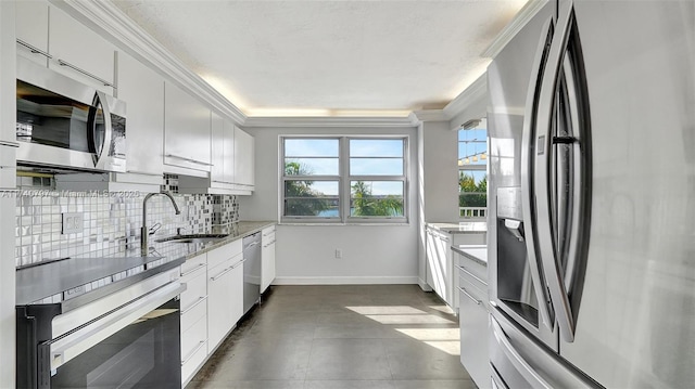 2801 NE 183rd St Unit 517W, Aventura, FL 33160 - kitchen with appliances with stainless steel finishes, decorative backsplash, a sink, light stone counters, and ornamental molding