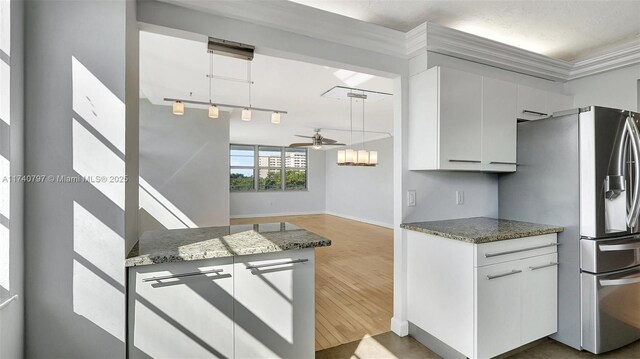 2801 NE 183rd St Unit 517W, Aventura, FL 33160 - kitchen featuring stainless steel refrigerator with ice dispenser, a ceiling fan, dark wood-style floors, baseboards, and white cabinets
