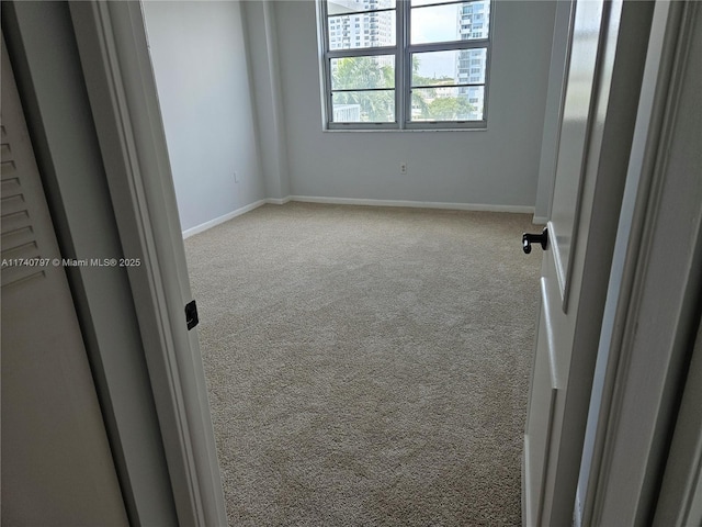 2801 NE 183rd St Unit 517W, Aventura, FL 33160 - carpeted empty room featuring baseboards
