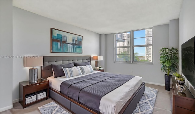 2801 NE 183rd St Unit 517W, Aventura, FL 33160 - bedroom featuring baseboards and light carpet